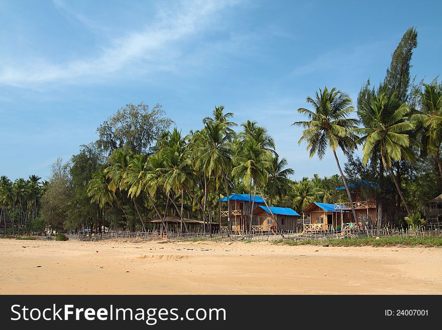 Beautiful view of beach, summer houses and palm trees in Polem, Goa, India. Beautiful view of beach, summer houses and palm trees in Polem, Goa, India