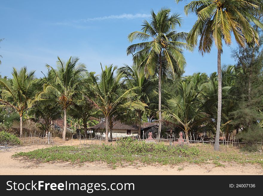 Beautiful view of beach, summer houses and palm trees in Polem, Goa, India. Beautiful view of beach, summer houses and palm trees in Polem, Goa, India