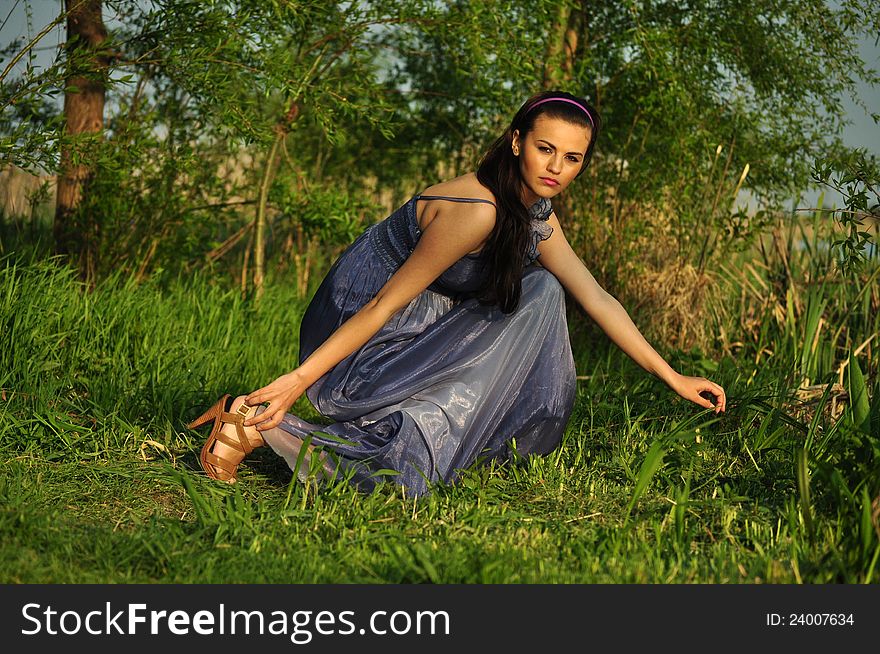 Portrait of the beautiful woman in the forest. Portrait of the beautiful woman in the forest