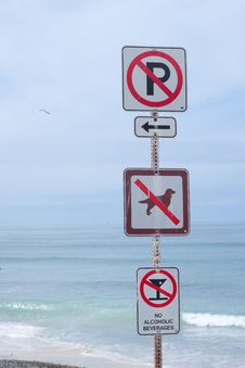 Four Warning Marks On Beach Stock Photo
