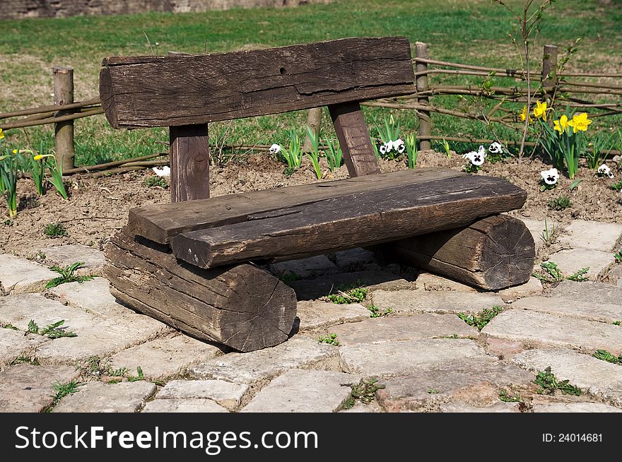 A handmade wooden bench in the garden