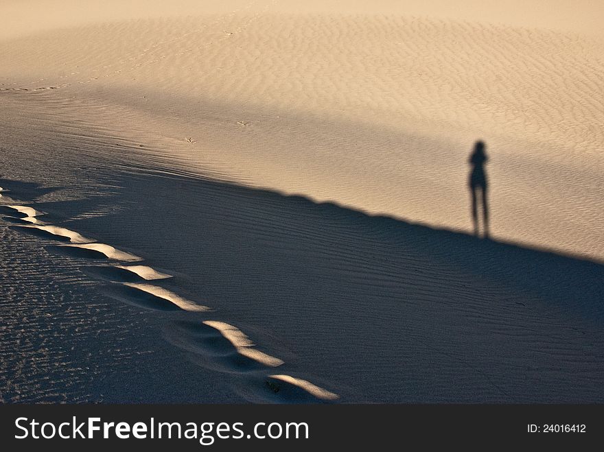 Shadow play at Stovepipe Wells in Mesquite Flats. Shadow play at Stovepipe Wells in Mesquite Flats