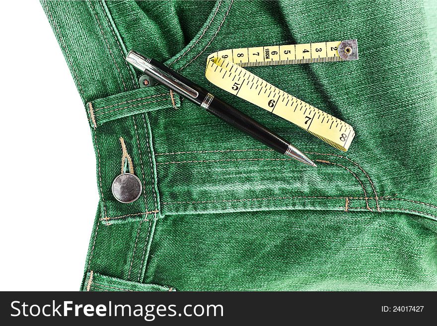 Pen and measuring tape on jeans. Pen and measuring tape on jeans