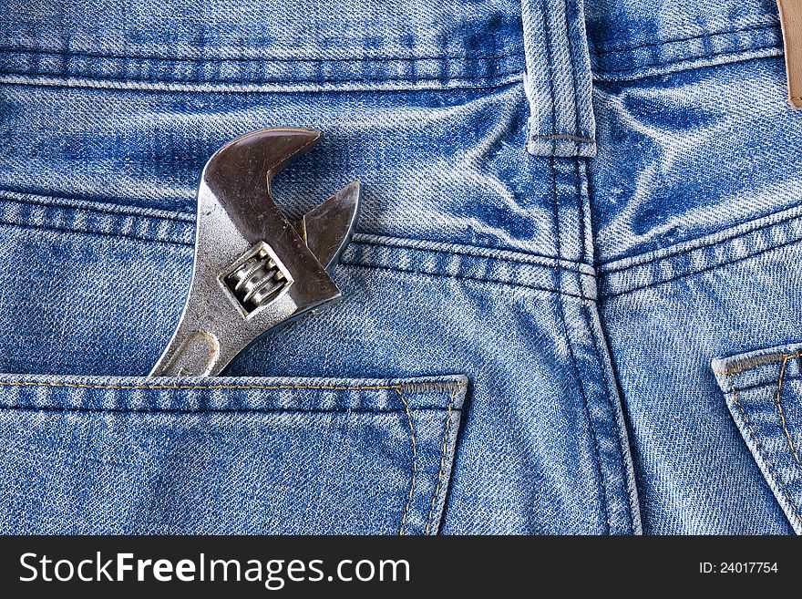Blue jeans pocket with old tool. Blue jeans pocket with old tool