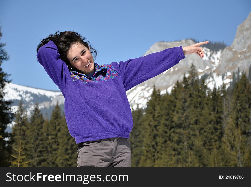 Portrait of a happy young woman at winter, in the mountains. Portrait of a happy young woman at winter, in the mountains
