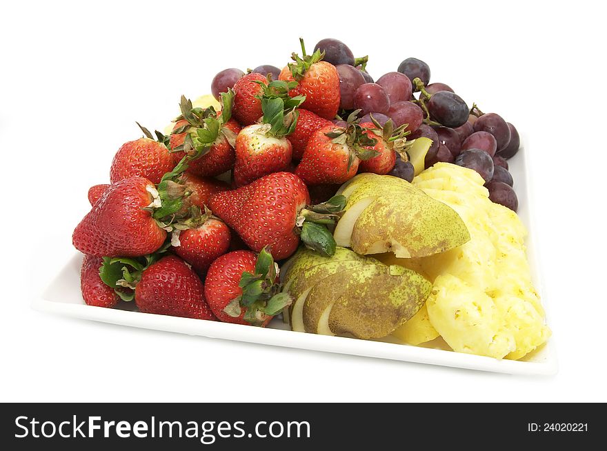 Strawberries and citrus fruit on a plate on a white background. Strawberries and citrus fruit on a plate on a white background