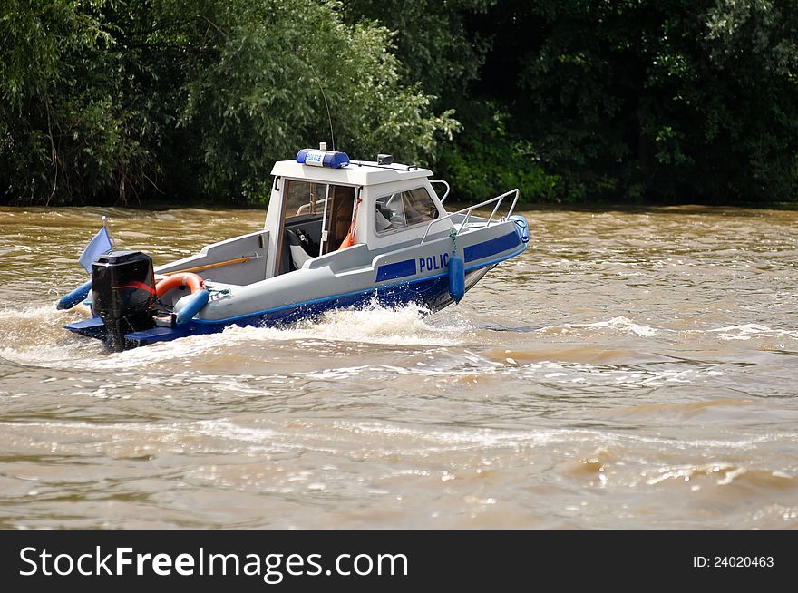 Water police motorboat patroling river