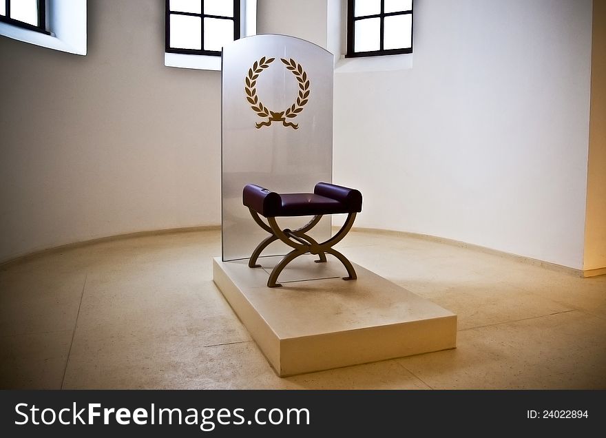 Minimalistic, mystic throne in empty room