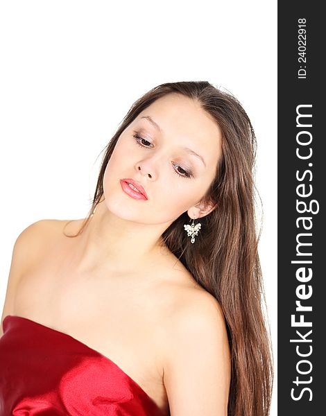 Beautiful brunette girl wearing red dress looks down isolated on white background. Beautiful brunette girl wearing red dress looks down isolated on white background