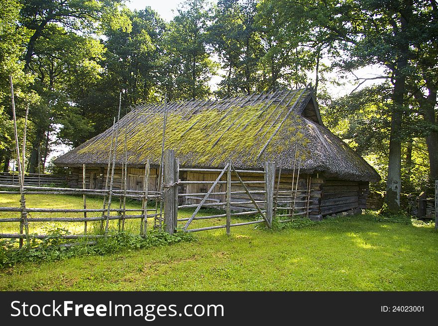 Traditional thatched roof farmhouse located in Estonia, National Open Air Museum. Traditional thatched roof farmhouse located in Estonia, National Open Air Museum