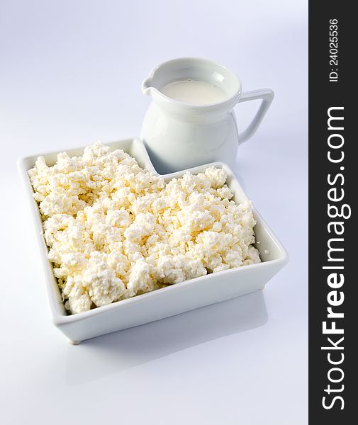 Dairy products on a white reflective background. Dairy products on a white reflective background.