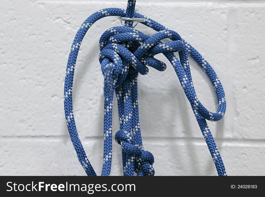 Blue rope with multiple loops and knots. Blue rope with multiple loops and knots