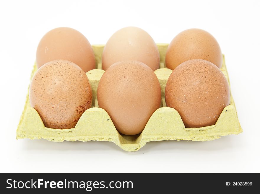 Half a dozen fresh eggs with white background