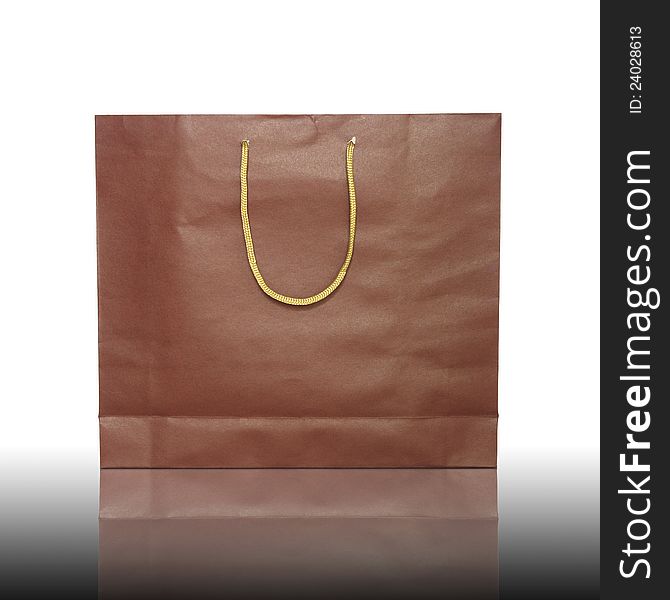 Red shopping bag on reflect floor and white background