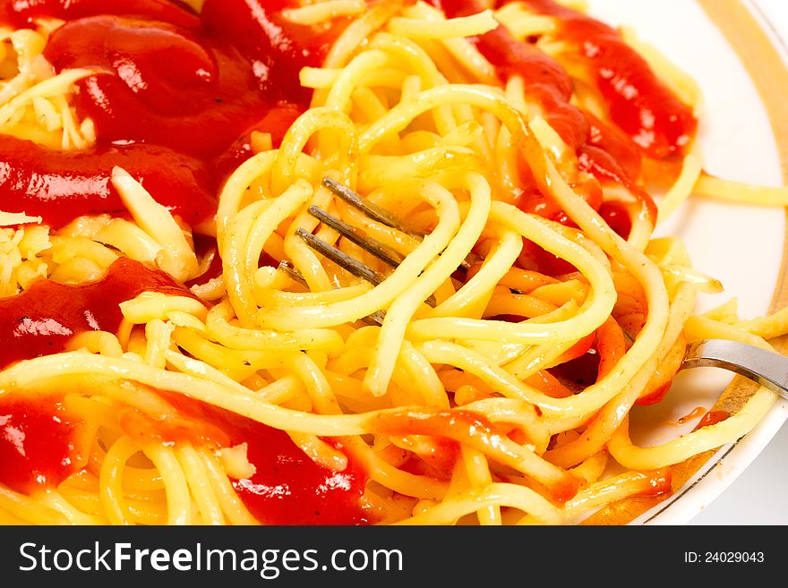 Pasta in fork on dish food background