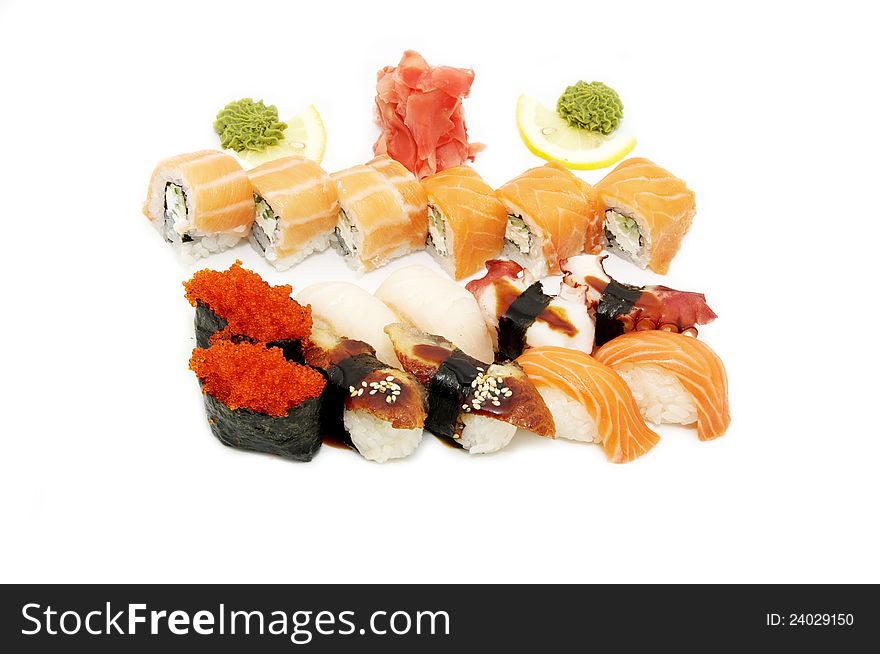 Assortment of sushi rice and seafood on white background