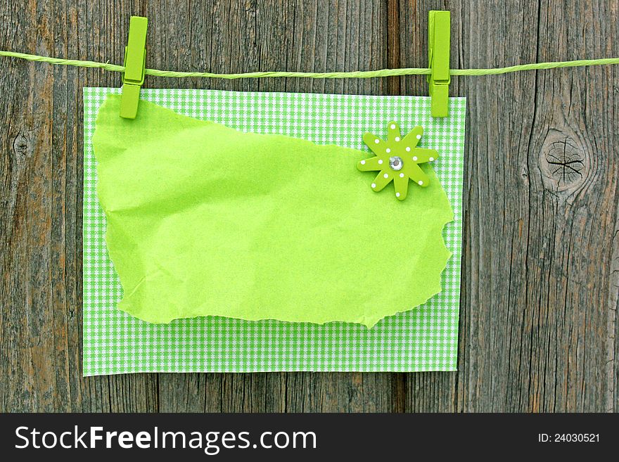Blank letter  hanging on washing line, on wooden wall. Blank letter  hanging on washing line, on wooden wall