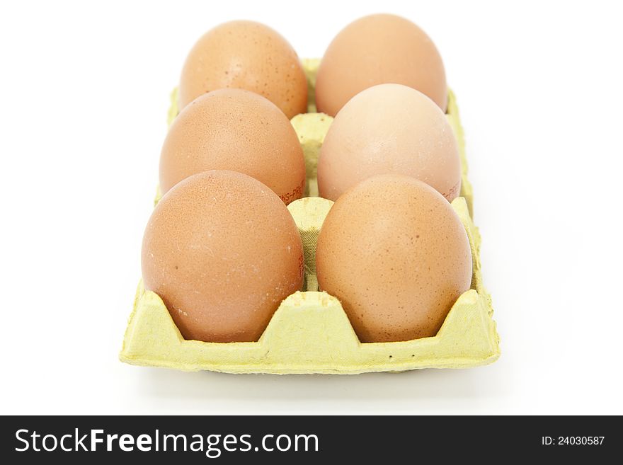 Half a dozen fresh eggs with white background