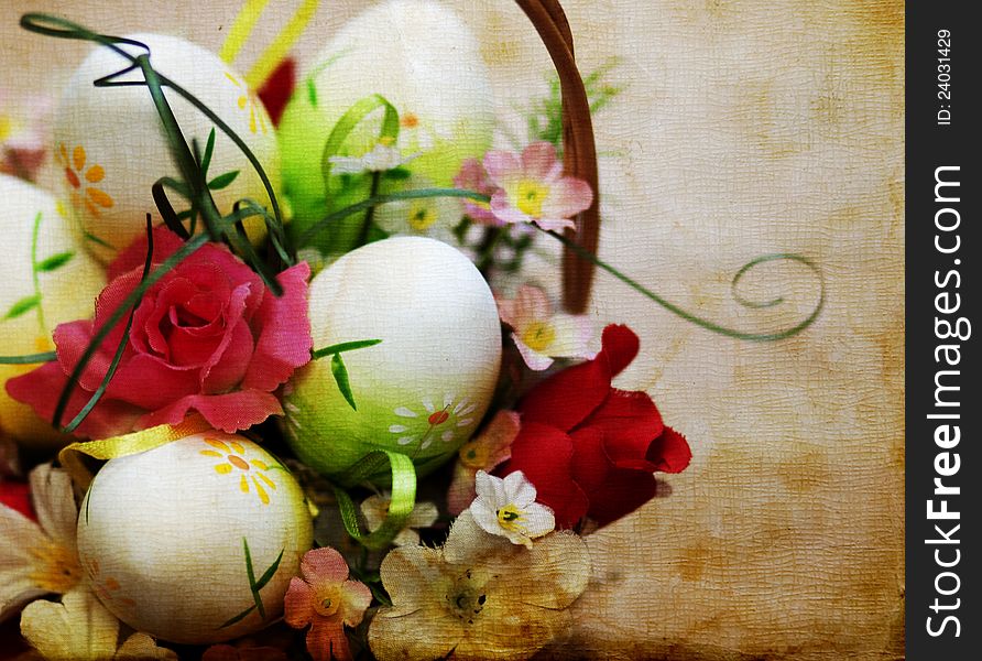 Vintage photo of a basket with easter eggs and flowers