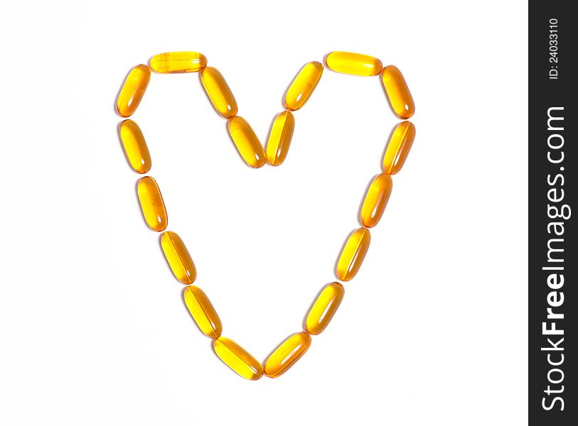 Fish oil capsule in the shape of a heart. Fish oil capsule in the shape of a heart