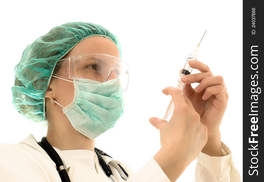 Female doctor wearing a mask, the hands of needles. Wearing white coat. Female doctor wearing a mask, the hands of needles. Wearing white coat.
