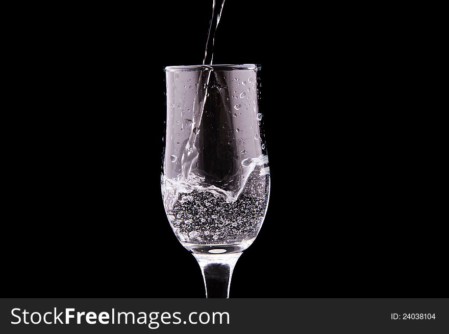 Water glass isolated on the black
