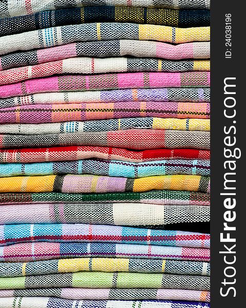 Colorful of Thai Northeastern fabric, colorful and heap of Thai style native clothing