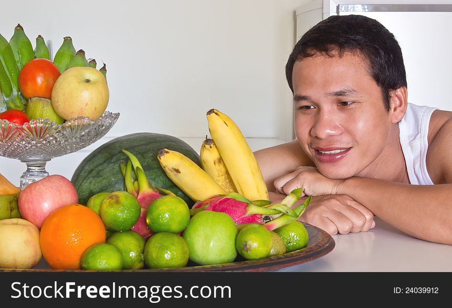 Man Looking At Fruits