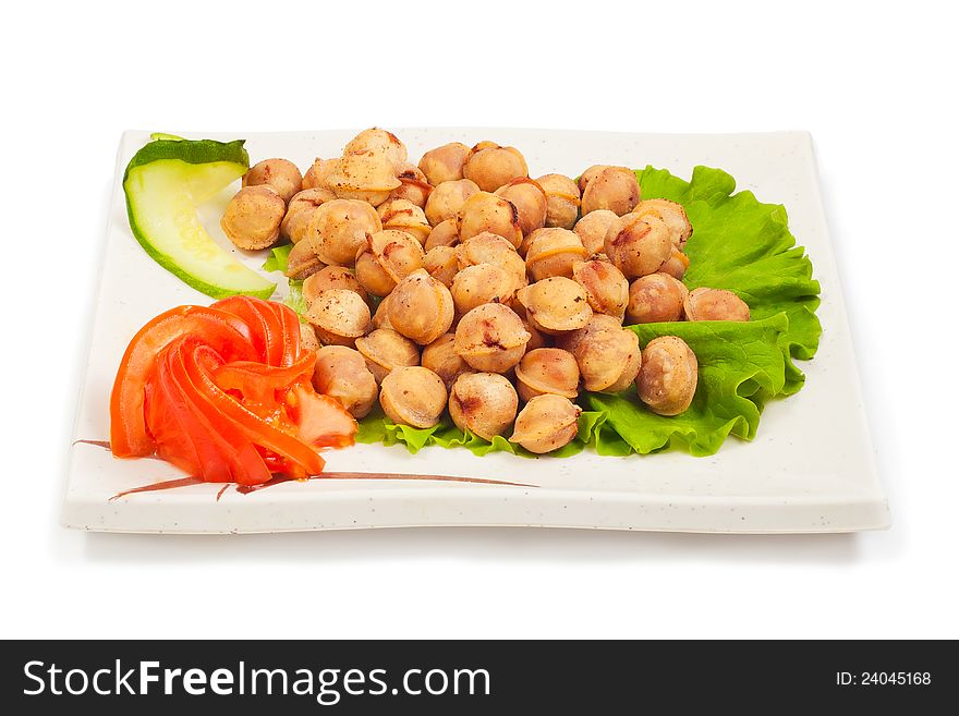 Fried small ravioli on a plate on a white background