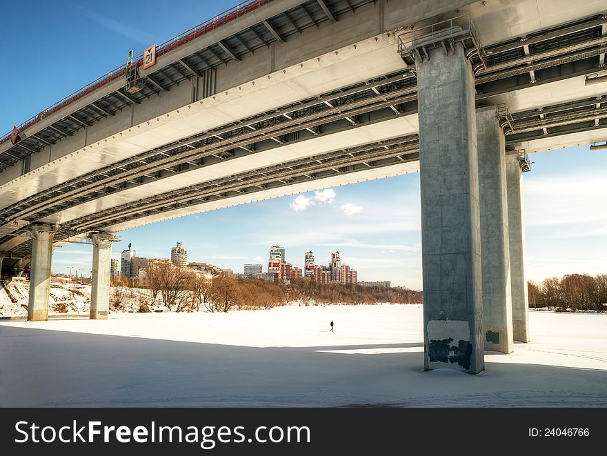 Modern bridge through a Moskva River (Zhivopisny bridge) in winter in Moscow