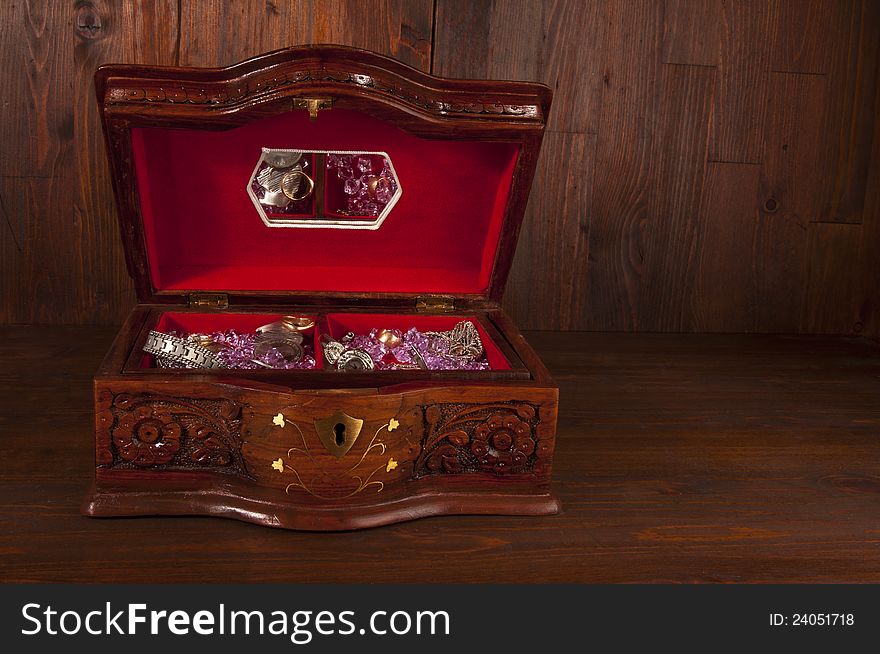 Treasure chest with jewelry coins and gems