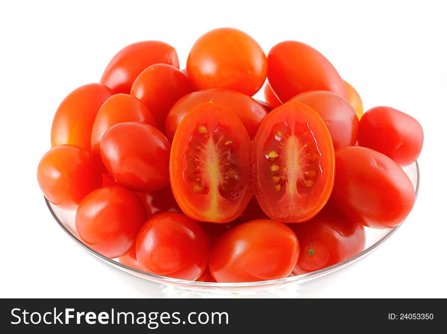 Closeup photo of fresh Cherry Tomatoes (Cocktail tomato) in a cocktail glass, isolated on white background. Closeup photo of fresh Cherry Tomatoes (Cocktail tomato) in a cocktail glass, isolated on white background