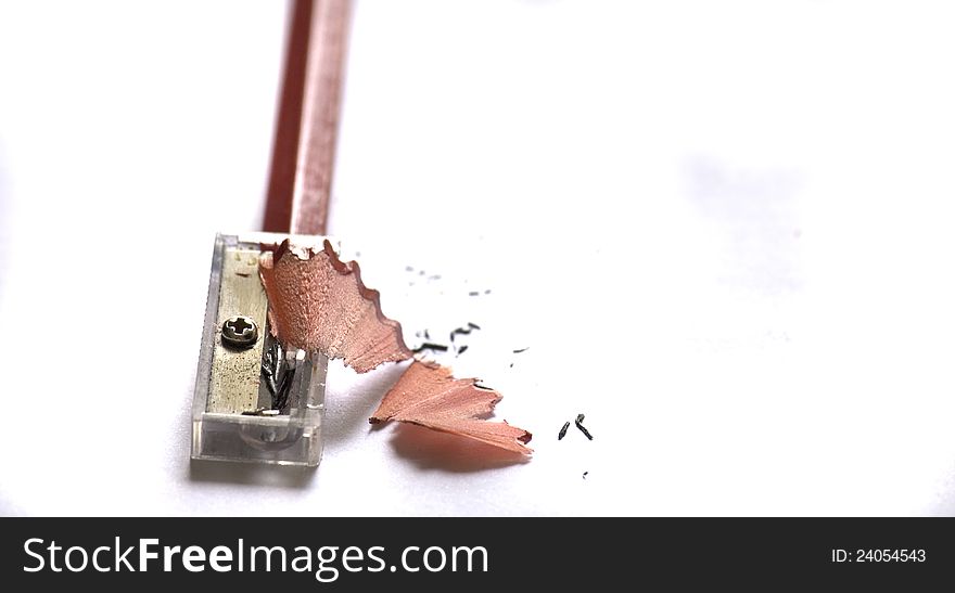 Pencil and Sharpener on White Background