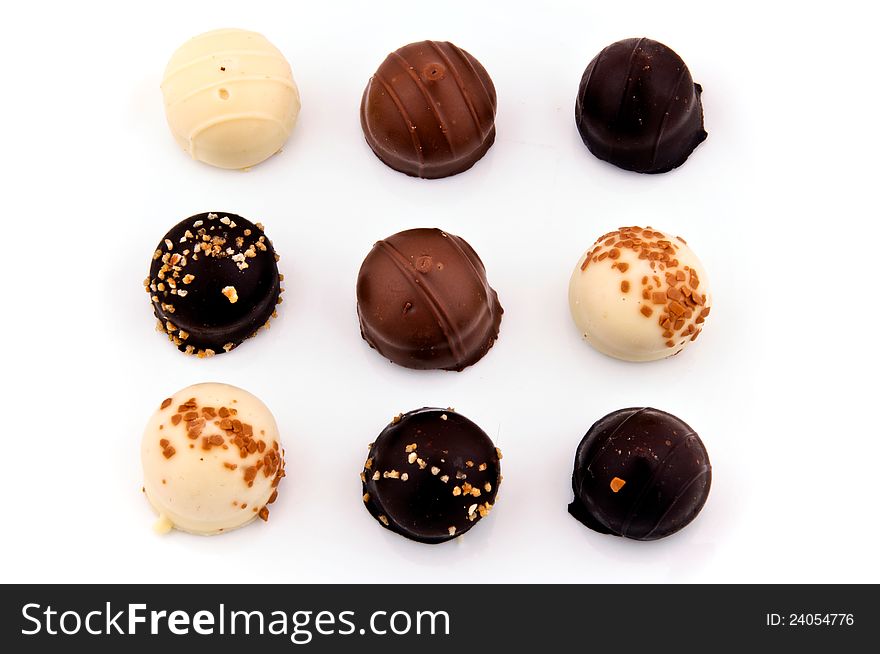 Belgian chocolate pralines isolated on white