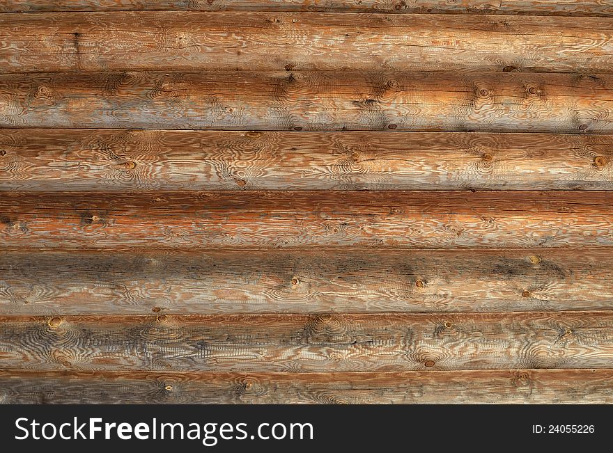 Wall of the rural house from wooden logs