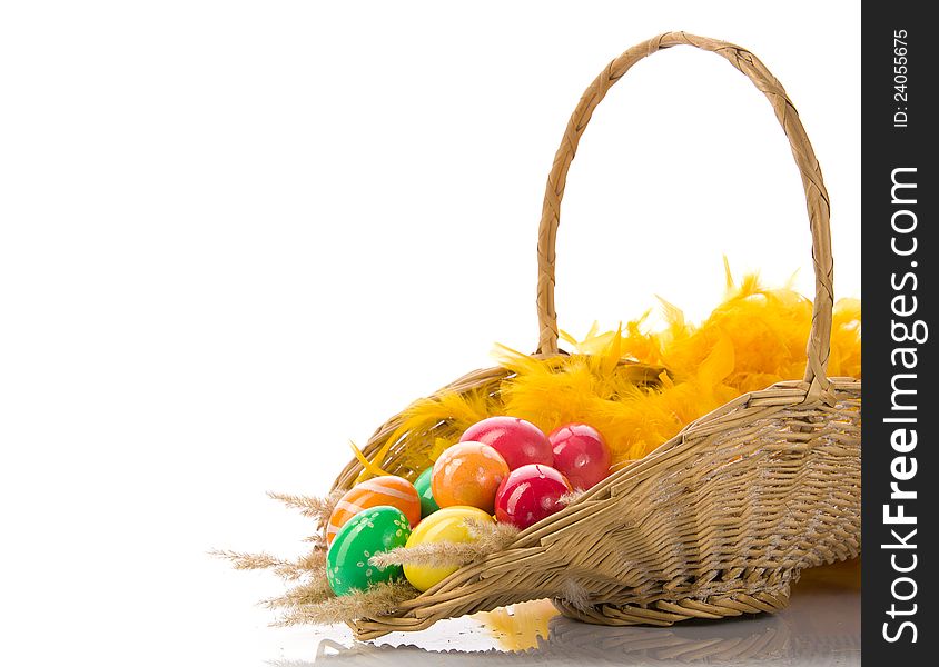 Basket with colorful Easter eggs on a white background. Basket with colorful Easter eggs on a white background