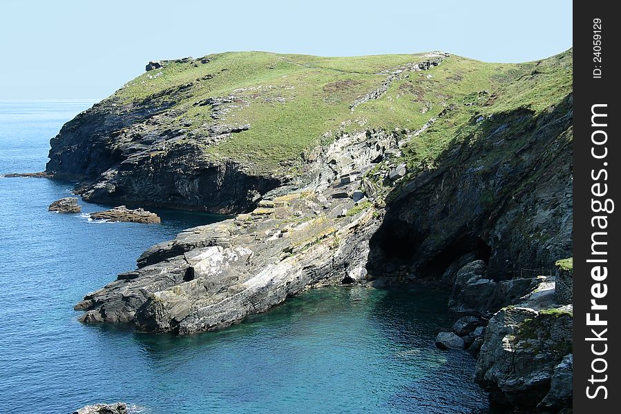 An almost magical cliff shot of the supposed birth place of King Arthur, Tintagel in Cornwall, England. An almost magical cliff shot of the supposed birth place of King Arthur, Tintagel in Cornwall, England