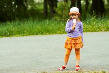 Girl With Ice Cream Stands Royalty Free Stock Images