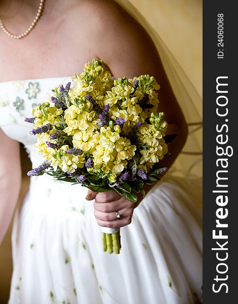 A Bride holding her large wedding bouquet of flowers