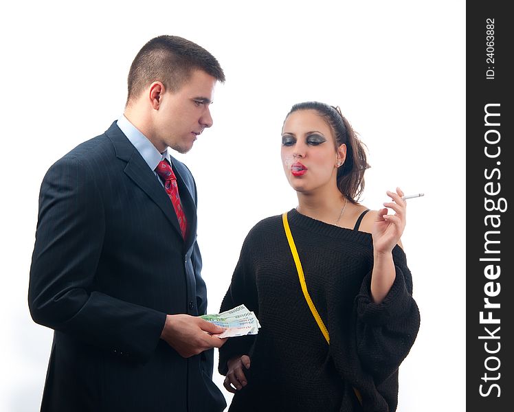 Young serious businessman giving money to lady