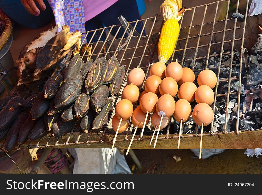 Grilled egg and potato in Thai rural market