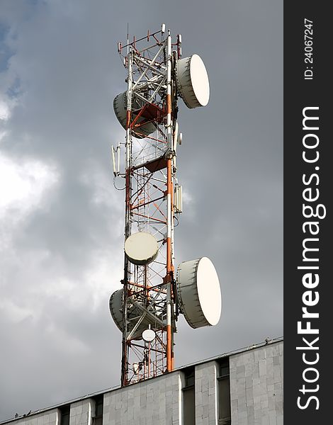 Radio, television ,telephone - antenna . Background -  cloudy sky. Radio, television ,telephone - antenna . Background -  cloudy sky