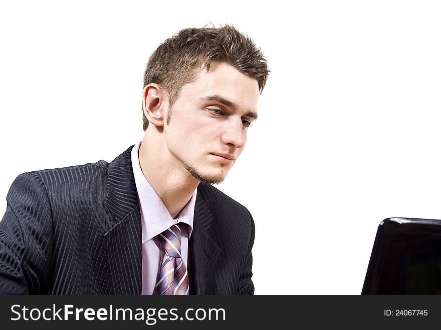 Handsome guy with a laptop isolated