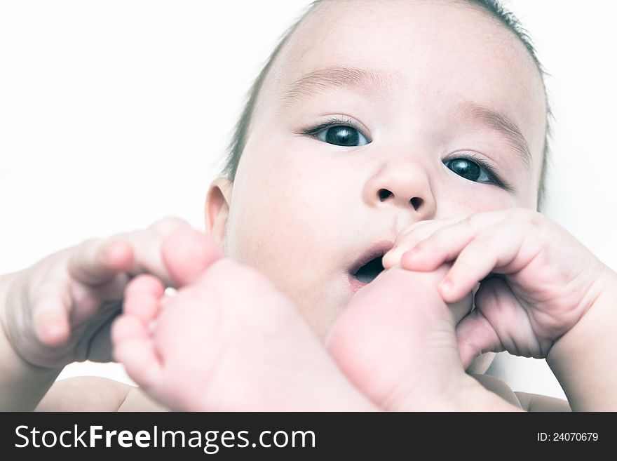 Portrait of a child sucks his toe. Portrait of a child sucks his toe