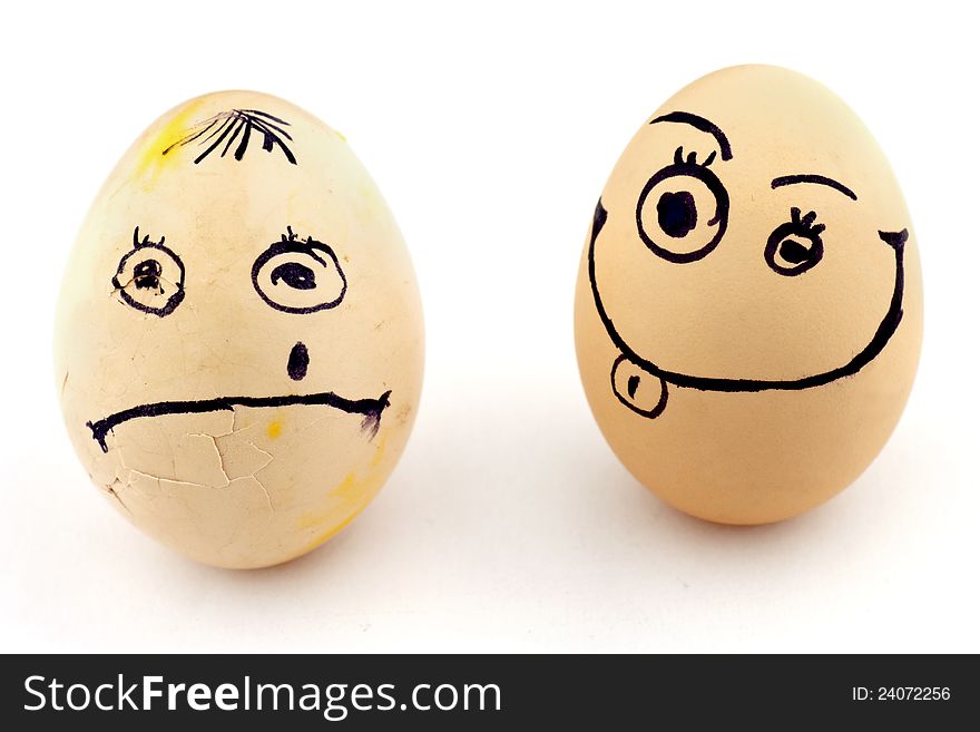 Happy and sad eggs with faces isolated on white