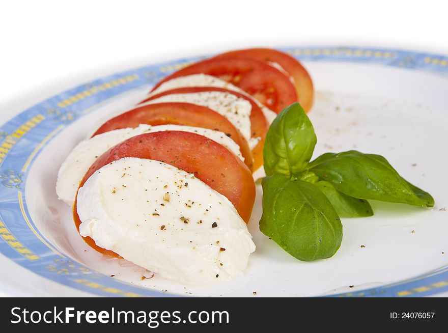 Healthy and colorful vegetable salad. Tomato, lettuce and mozzarella with herbs. Healthy and colorful vegetable salad. Tomato, lettuce and mozzarella with herbs.