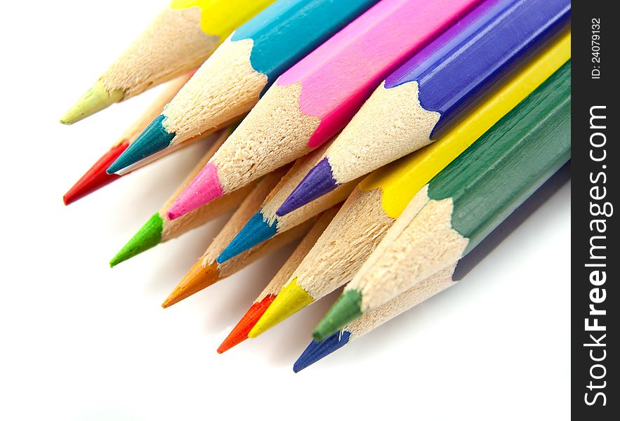 Color pencils  on a white background top view. Color pencils  on a white background top view