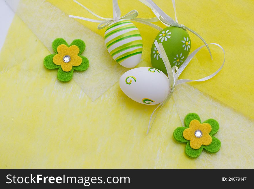 Colorful Easter eggs on a yellow background