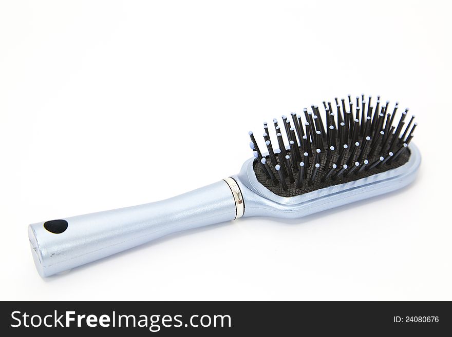 Brush hair with plastic spikes and white background. Brush hair with plastic spikes and white background