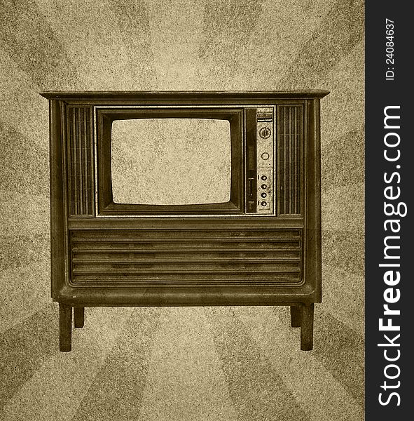 Vintage television on grunge paper with abstract sun rays